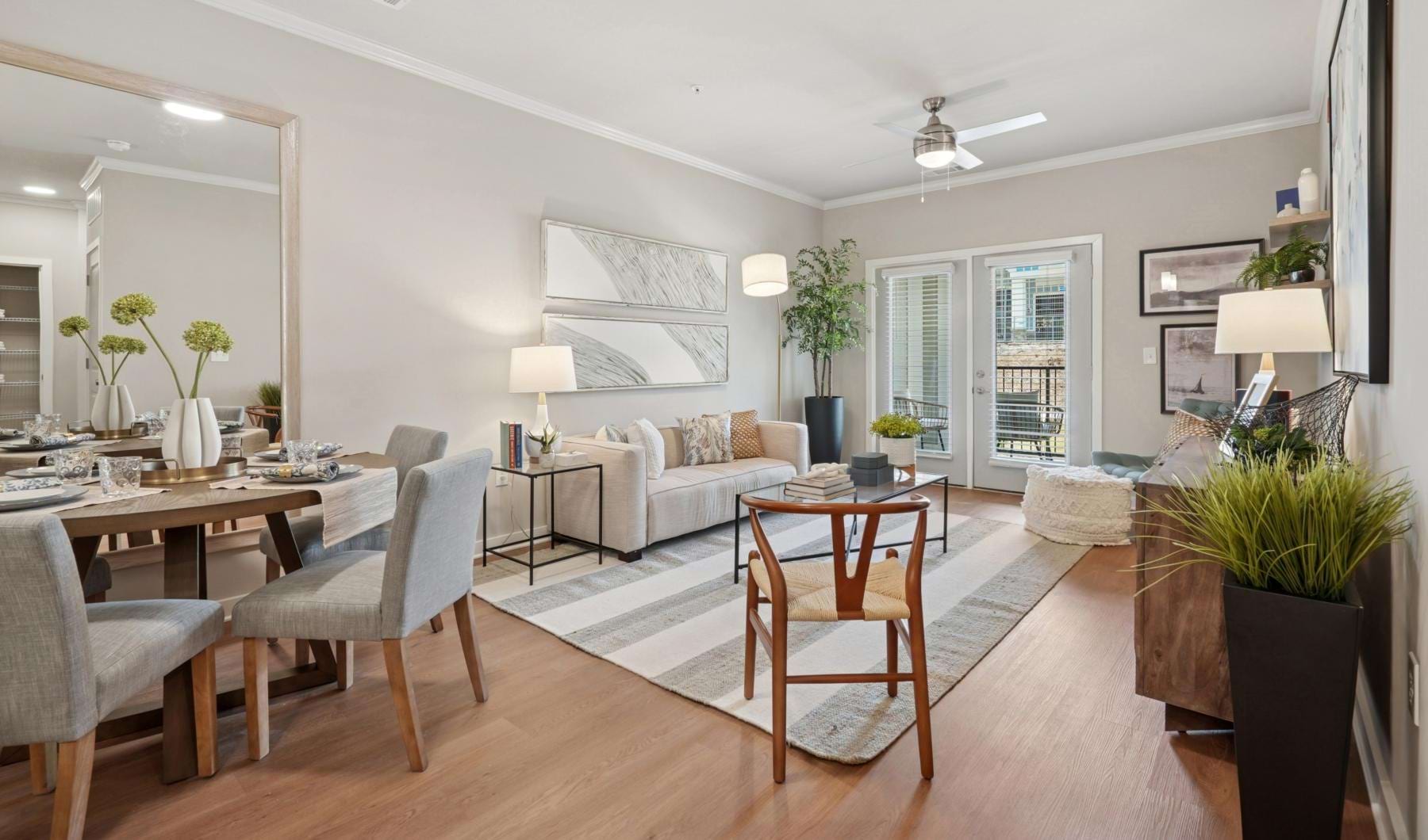 a living room with a table and chairs