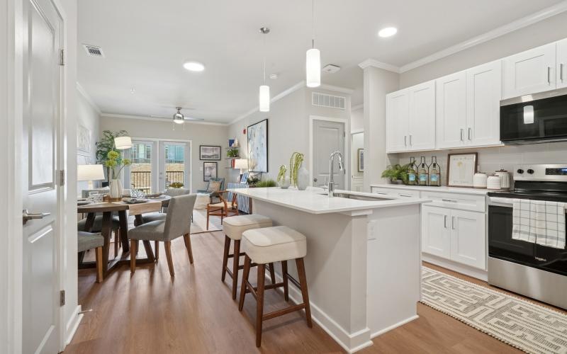 a kitchen with white cabinets