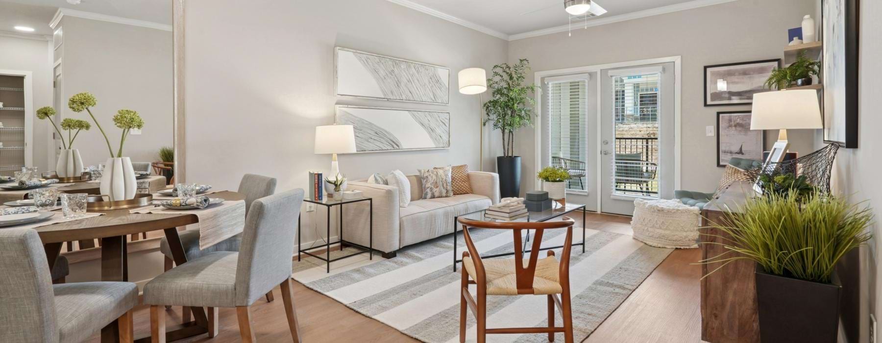a living room with a table and chairs